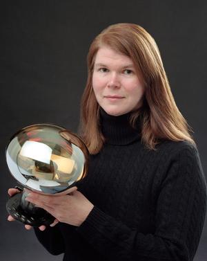 Janet Conrad holding a Phototube